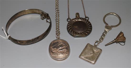 Silver bangle, envelope stamp case on fob, HMS Victory pendant on chain and a scent bottle pendant and funnel